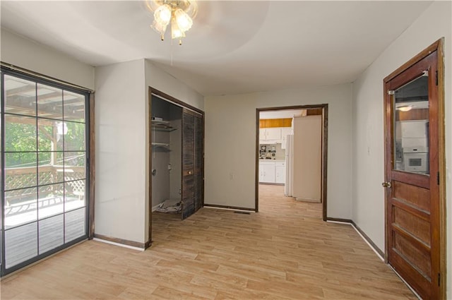 corridor featuring light hardwood / wood-style flooring