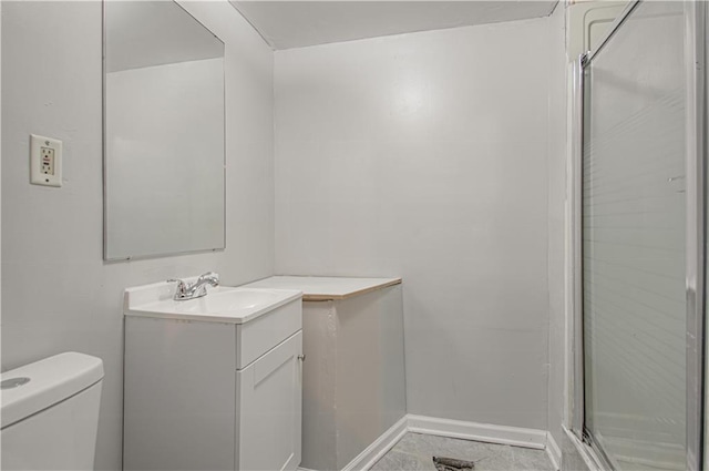 bathroom with tile patterned floors, vanity, toilet, and an enclosed shower