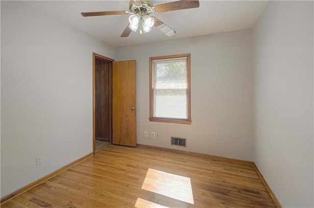 unfurnished room with light wood-type flooring and ceiling fan