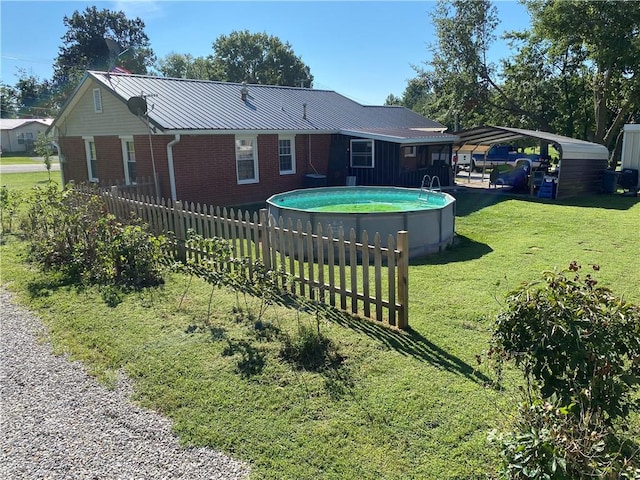 exterior space featuring a carport, central AC, a lawn, and a fenced in pool