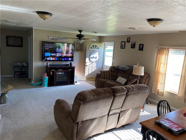 living room featuring light carpet and ceiling fan