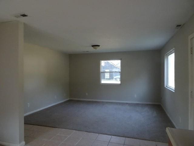 empty room featuring light carpet