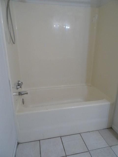 bathroom featuring tile patterned floors and tub / shower combination