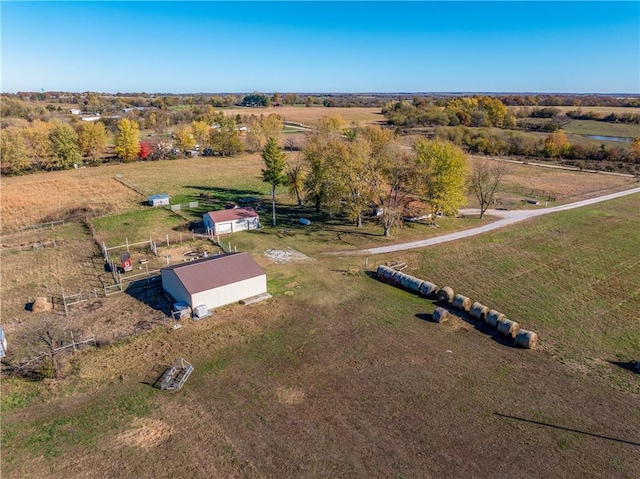 birds eye view of property with a rural view