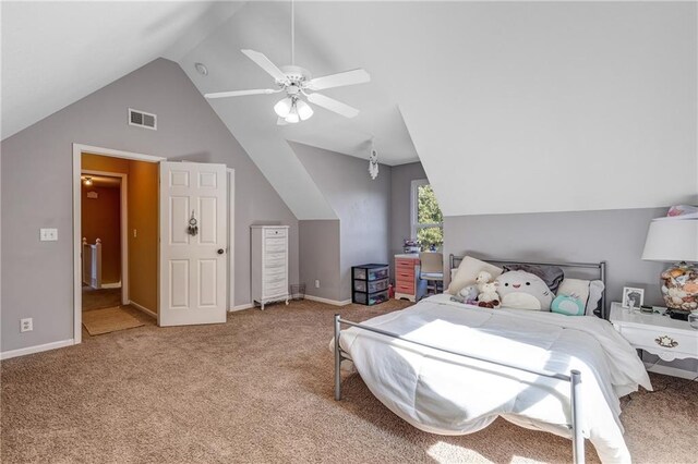 bedroom with carpet, visible vents, a ceiling fan, vaulted ceiling, and baseboards