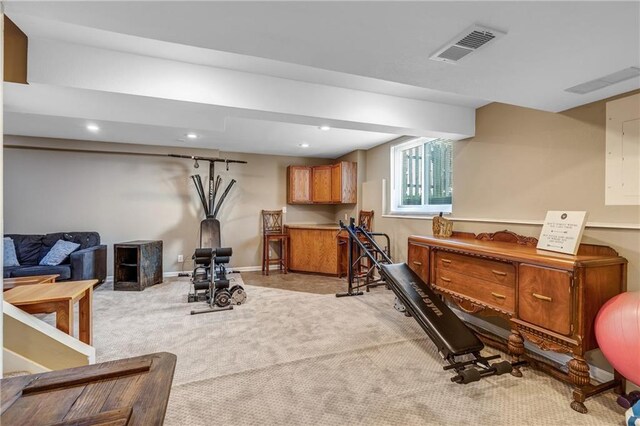 exercise area with light carpet, baseboards, visible vents, and recessed lighting