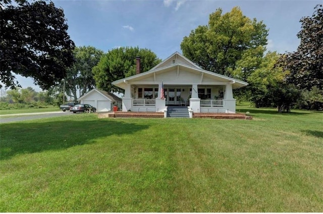 view of front of home featuring covered porch and a front yard