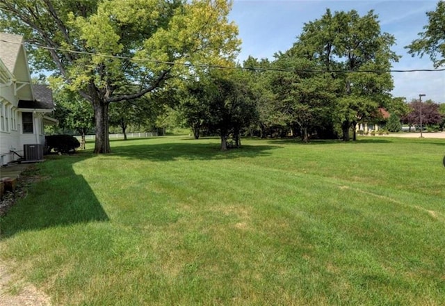 view of yard featuring central air condition unit