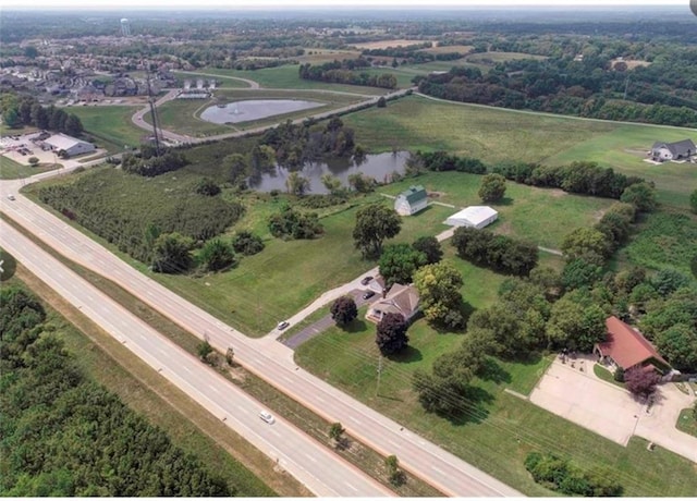 aerial view featuring a water view and a rural view