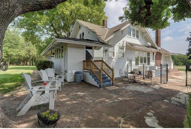 back of house featuring a patio