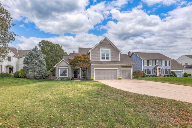 view of front of home featuring a front yard and a garage