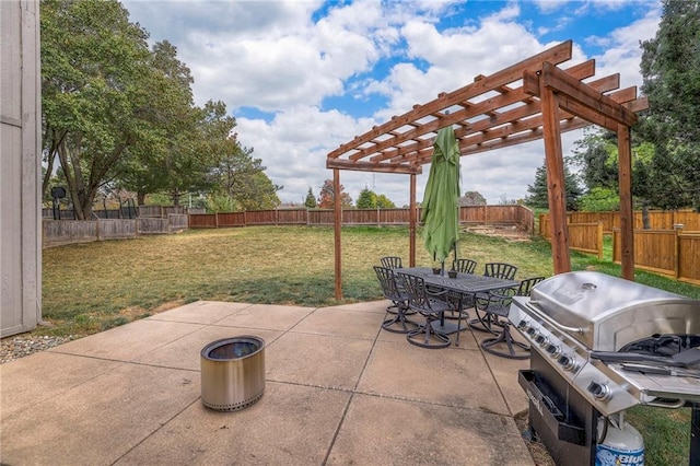 view of patio with area for grilling and a pergola