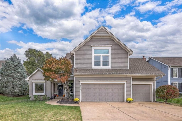 view of property with a front yard and a garage