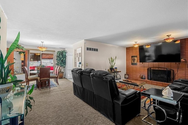 living room with carpet, a textured ceiling, and a fireplace