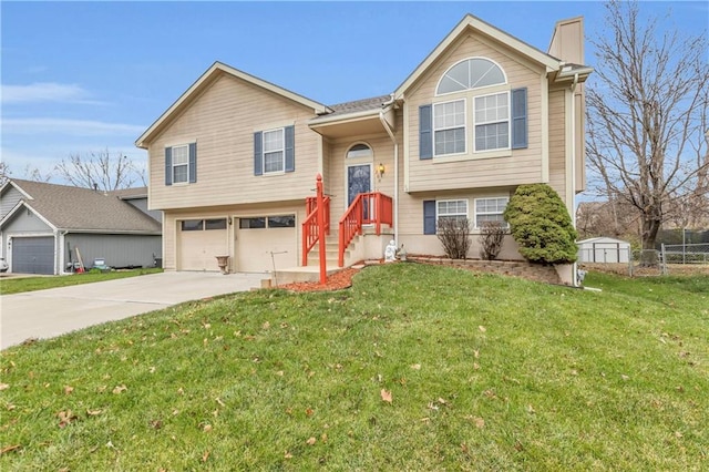 raised ranch featuring a front yard and a garage