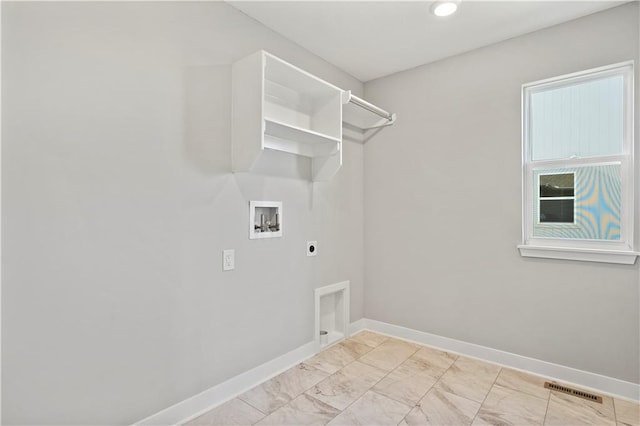 clothes washing area with washer hookup and electric dryer hookup