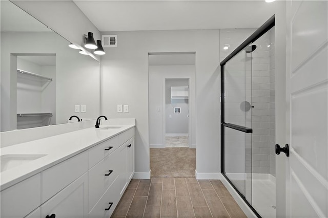 bathroom featuring vanity and walk in shower