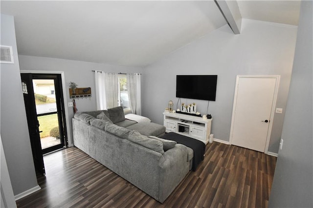 living room with lofted ceiling with beams, dark hardwood / wood-style flooring, and a healthy amount of sunlight