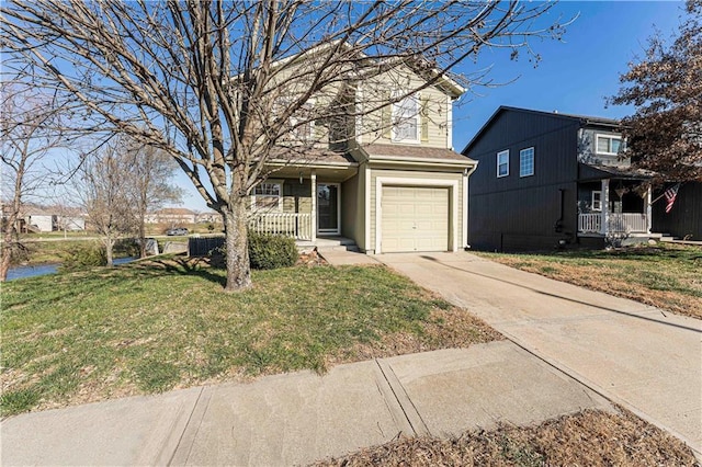 view of front property featuring a garage, covered porch, and a front yard