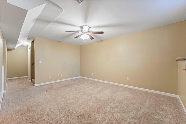 unfurnished room featuring light colored carpet and ceiling fan