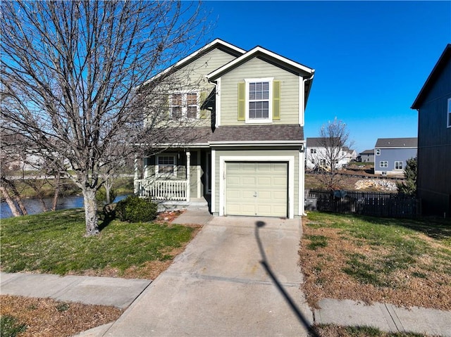 view of front of house with a porch, a garage, and a front yard