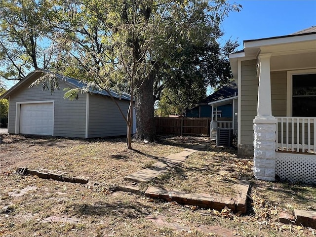 view of yard with an outbuilding and a garage