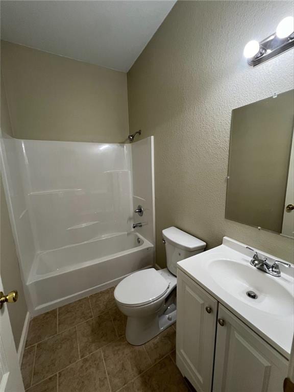 601 W 5th St, Pittsburg, KS 66762 - bathroom featuring toilet, vanity,  shower combination, a textured wall, and tile patterned floors