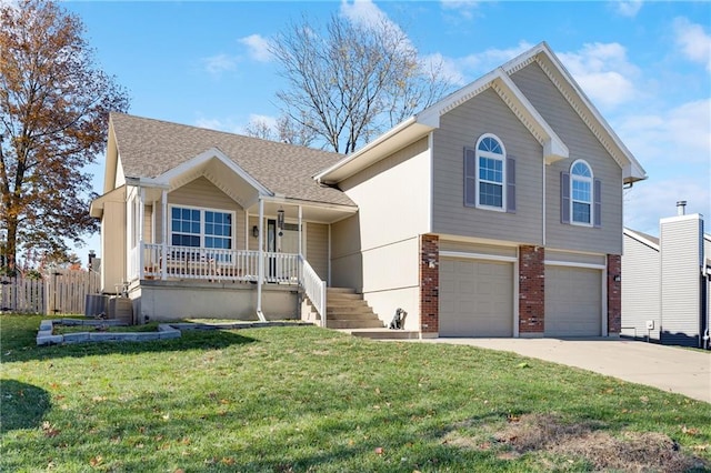 view of front of house featuring central air condition unit, a front lawn, a porch, and a garage