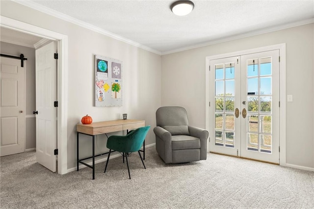 home office featuring ornamental molding, french doors, a barn door, and light colored carpet