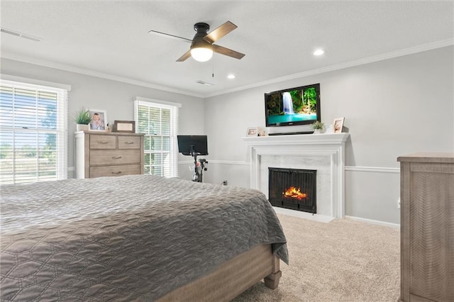 bedroom with ceiling fan, carpet, and ornamental molding