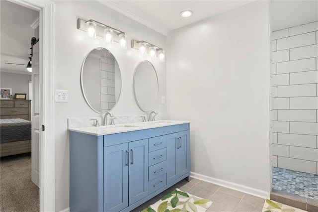 bathroom with vanity, ceiling fan, and tile patterned flooring