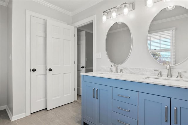 bathroom featuring vanity, ornamental molding, and tile patterned flooring