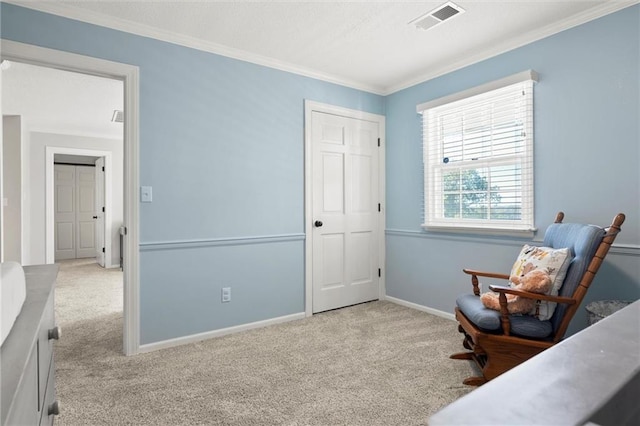 sitting room featuring ornamental molding and light carpet