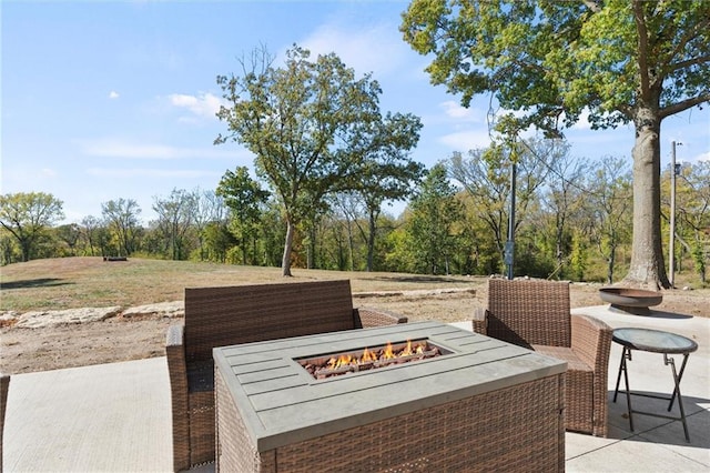 view of patio with an outdoor fire pit