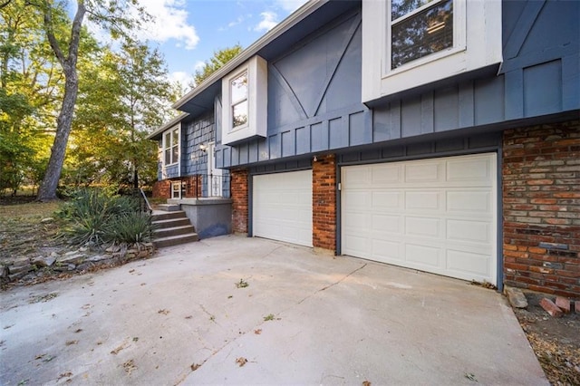 view of side of property with a garage