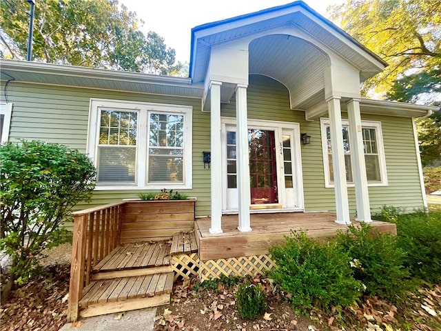 property entrance featuring a wooden deck