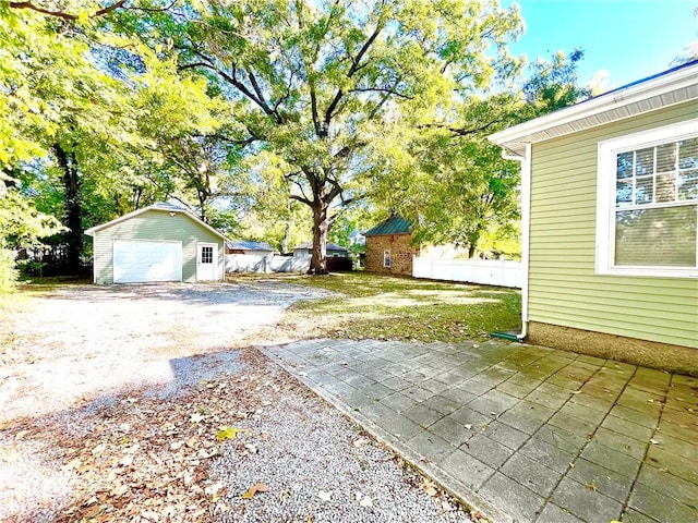 view of yard featuring a patio and a storage unit