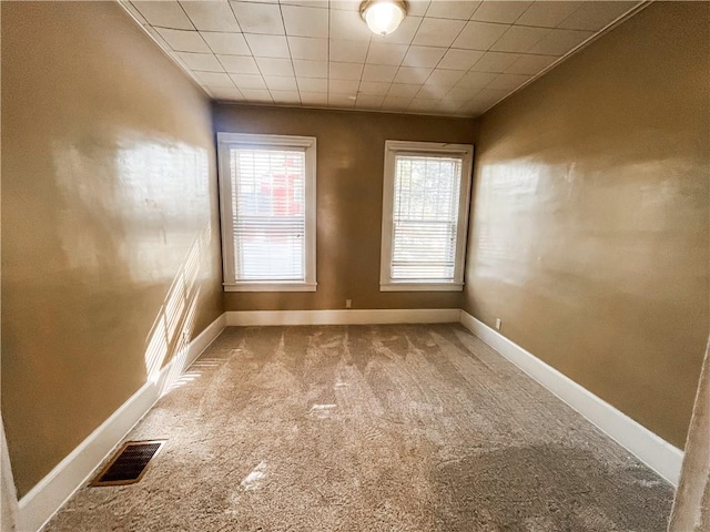 empty room featuring carpet floors