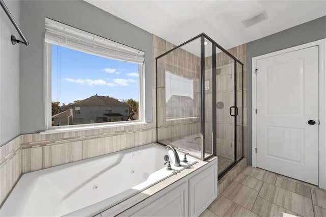 bathroom featuring plus walk in shower