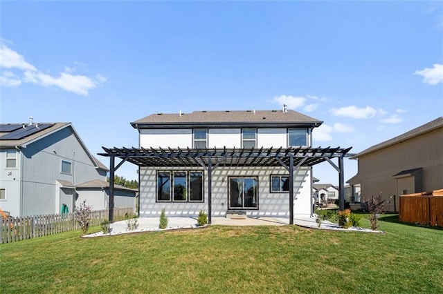 back of house featuring a pergola, a patio, and a yard