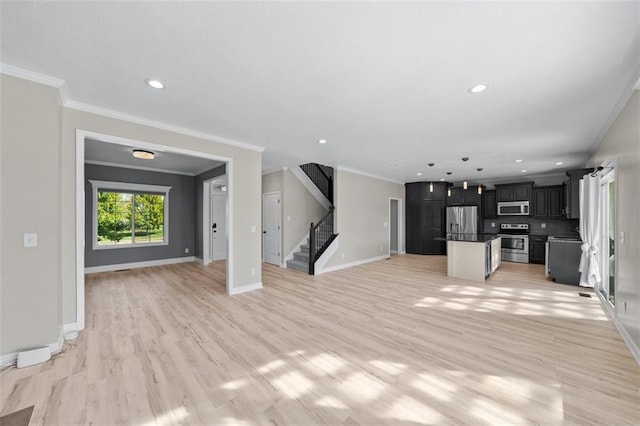 unfurnished living room featuring light hardwood / wood-style floors and crown molding