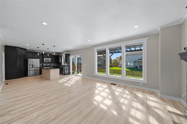 unfurnished living room with light hardwood / wood-style flooring and ornamental molding