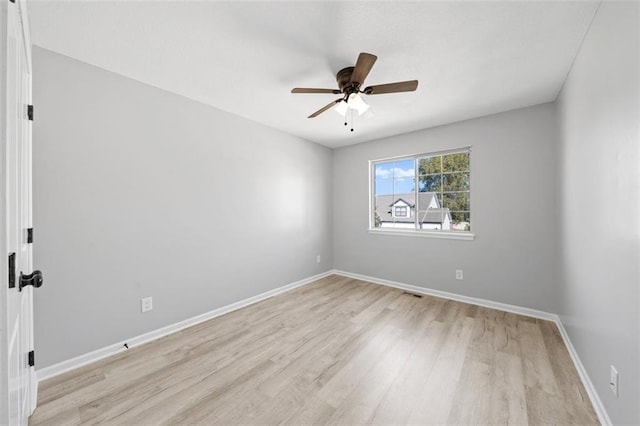 empty room with light wood-type flooring and ceiling fan