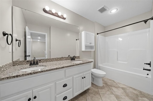 full bathroom with toilet, vanity, tile patterned floors, and shower / bathtub combination