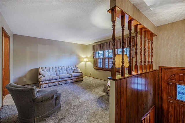 living room with carpet flooring and a textured ceiling