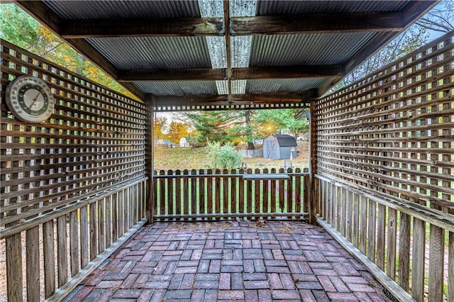 view of patio with a storage unit