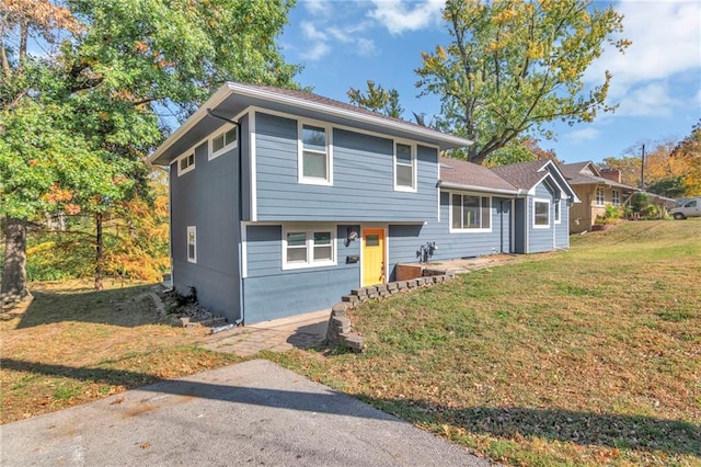 split level home with a front yard