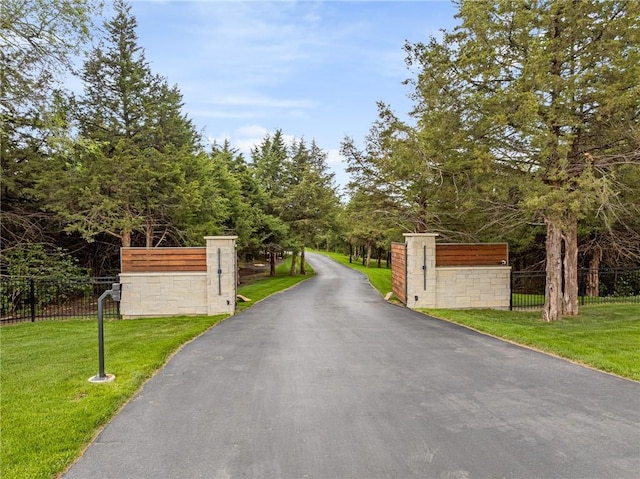 view of gate featuring a yard