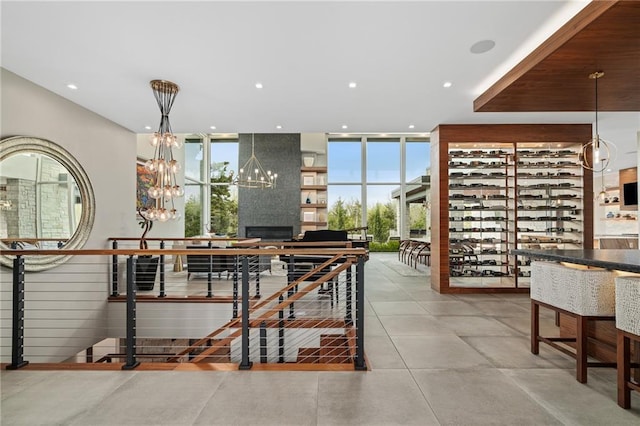 dining room with expansive windows, an inviting chandelier, and a wealth of natural light