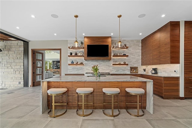 bar with light stone countertops, decorative backsplash, and decorative light fixtures